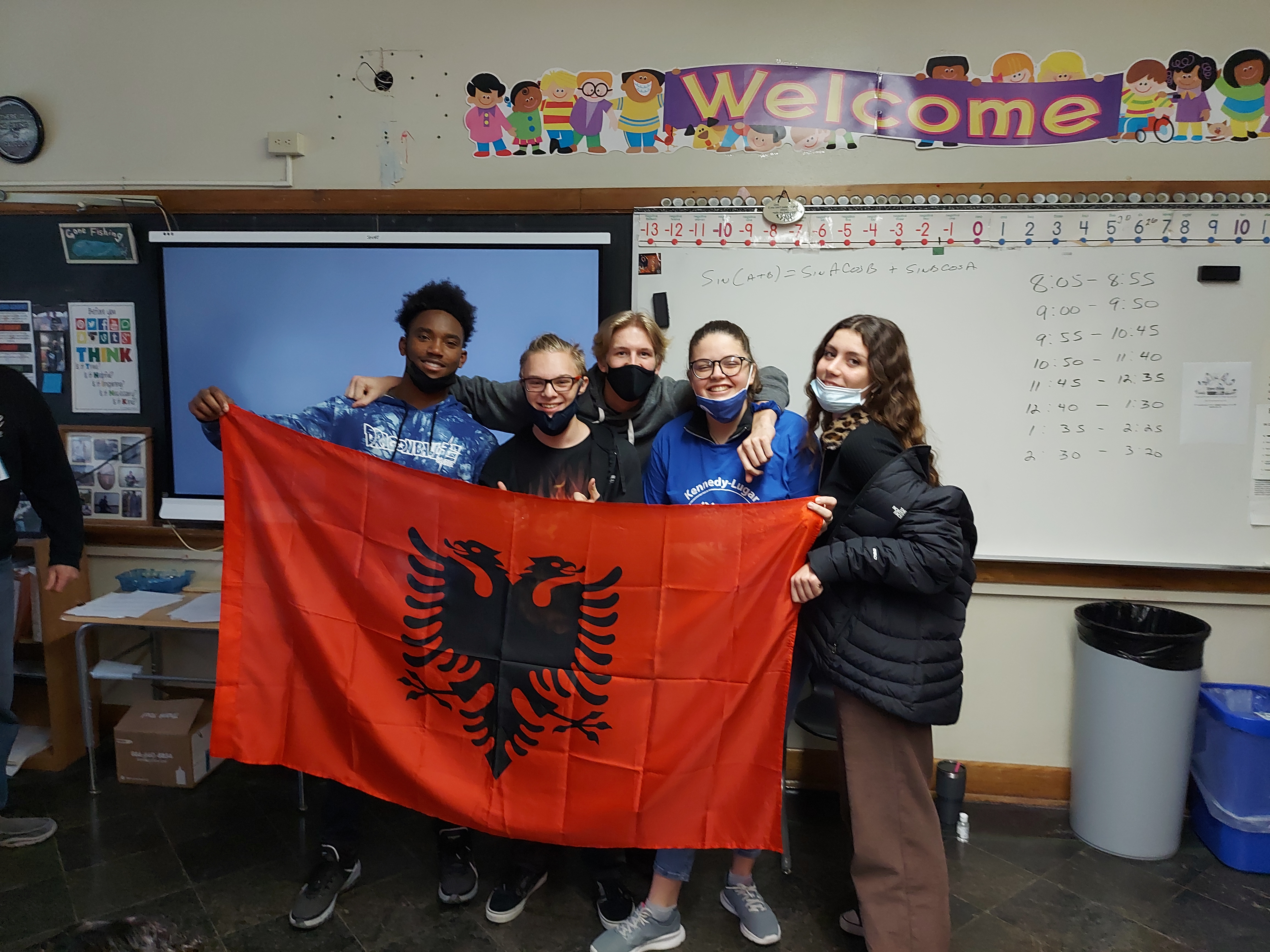 Mikea with classmates and albanian flag