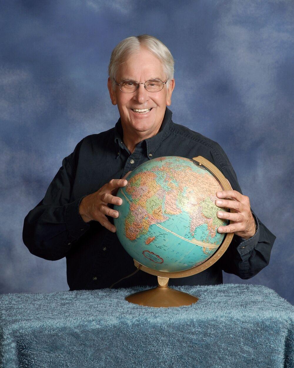 Jack Brennan with globe